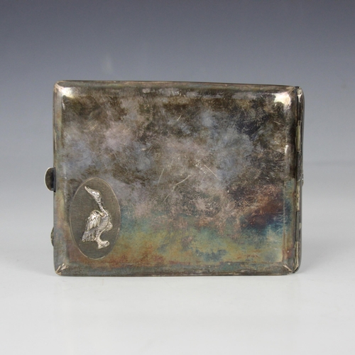 94 - A Chinese white metal cigarette case, of rectangular form with cast dragon detail to the front, cart... 