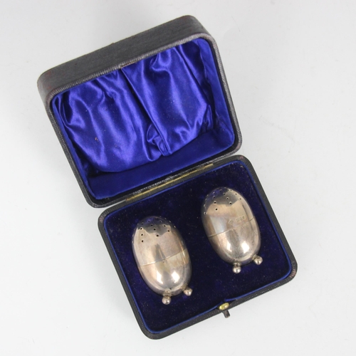 96 - A pair of Edwardian salt and pepper pots, Horace Woodward & Co Ltd, London 1901, of plain polished e... 