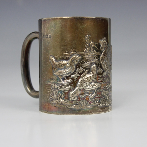 97 - An Edwardian silver christening mug, Joseph Gloster, Birmingham 1906, the cylindrical mug with embos... 