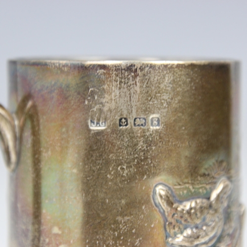 97 - An Edwardian silver christening mug, Joseph Gloster, Birmingham 1906, the cylindrical mug with embos... 