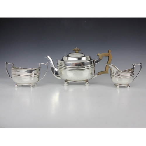 11 - A Victorian three piece silver tea service, Thomas Bradbury & Sons, London 1897, comprising sugar bo... 