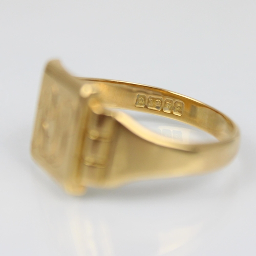 205 - An 18ct yellow gold signet ring, the rectangular shaped head with engraved monogram, leading to plai... 