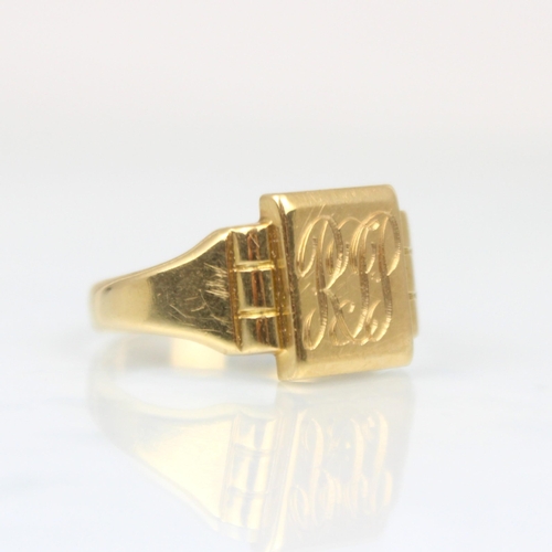 205 - An 18ct yellow gold signet ring, the rectangular shaped head with engraved monogram, leading to plai... 