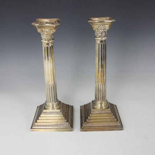 27 - A George V pair of silver candelabrum, Britton Gould and Co, Birmingham 1929, the triple branch abov... 