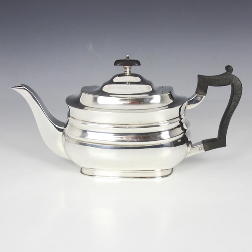 3 - A George V silver teapot, Goldsmiths and Silversmiths Co Ltd, Sheffield 1924, the hinged cover above... 