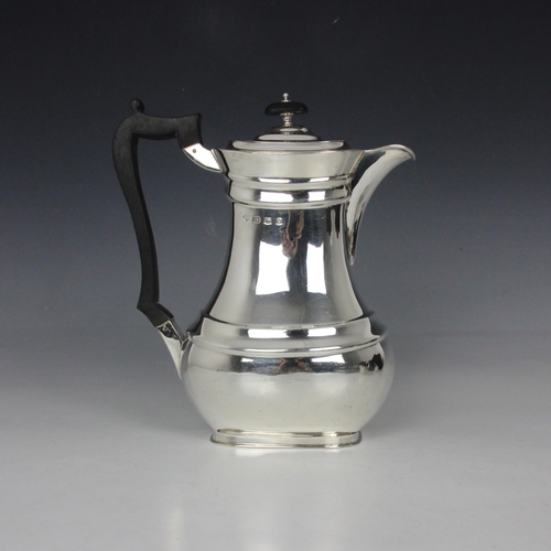 4 - A George V silver coffee pot, Goldsmiths and Silversmiths Co Ltd, Sheffield 1924, the hinged cover a... 