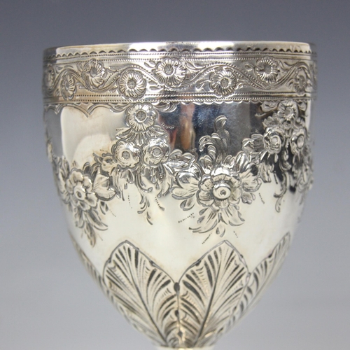 52 - A George III silver goblet, ‘RB’ Dublin 1791, the floral rim above an embossed garland and acanthus ... 