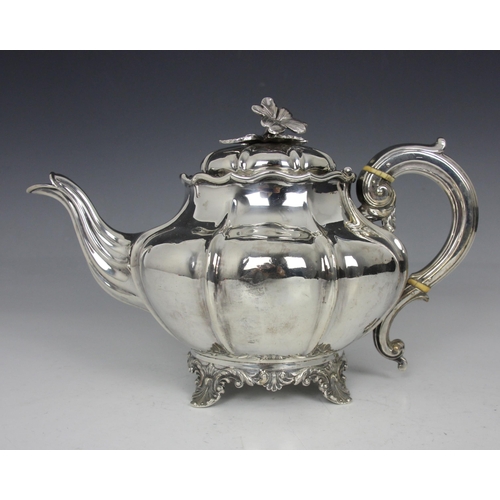 53 - A Victorian silver teapot, John and Henry Lias, London 1844, the cast flower head finial above lobed... 