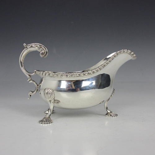 58 - A George V silver sauce boat, Goldsmiths and Silversmiths Company Ltd, London 1918, the acanthus cap... 