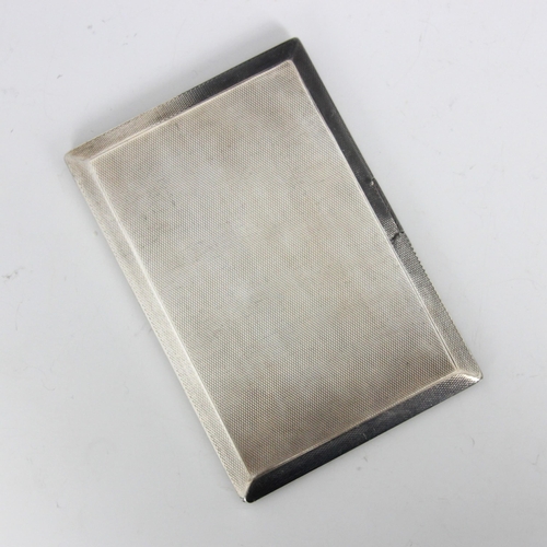 60 - A George V silver cigarette case, Thomas William Lack, London 1936, of rectangular form with engine ... 