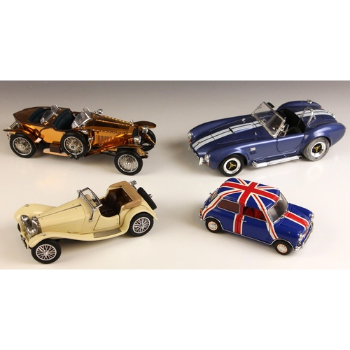 617 - Three Franklin Mint 1:24 scale die-cast model vehicles, comprising: 'The 1967 Morris Mini Cooper S',... 