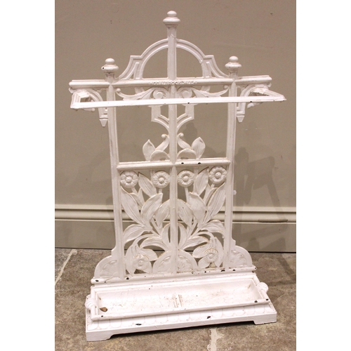 645 - A Victorian cast iron Coalbrookdale stick stand, the angular stick retainer upon a cast floral open ... 