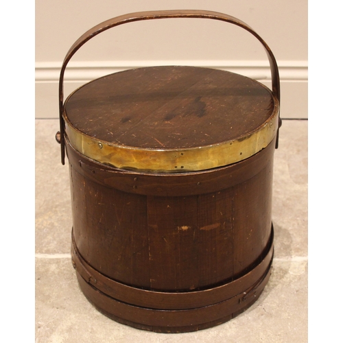 650 - A stained pine coopered peat bucket and cover, 19th century, of cylindrical form, with overhead swin... 