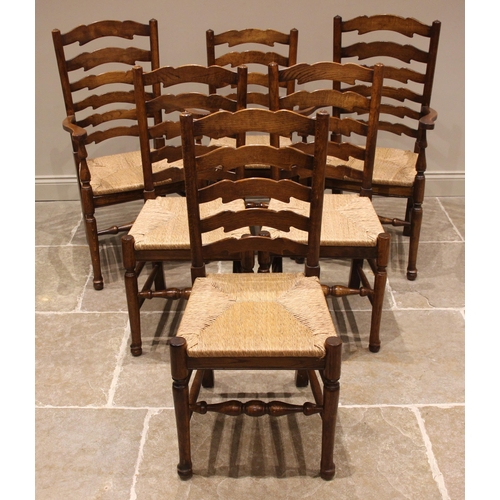 753 - A set of six 19th century style oak Lancashire ladder back kitchen chairs, late 20th century, each c... 