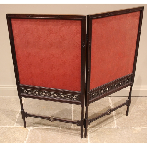 799 - A Chinese Chippendale style mahogany folding screen, 19th century, the twin screens enclosing needle... 