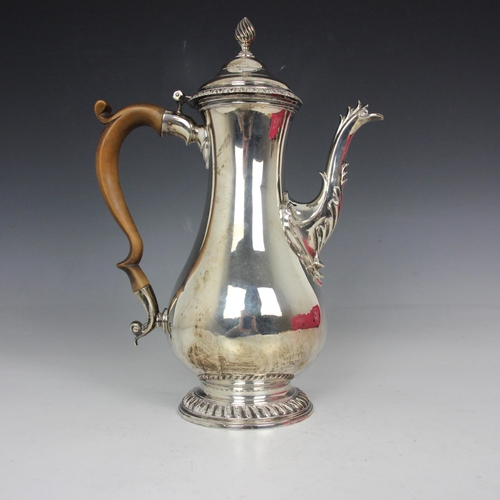 84 - A George III silver coffee pot, David Whyte and William Holmes, London 1765, the wrythen finial abov... 