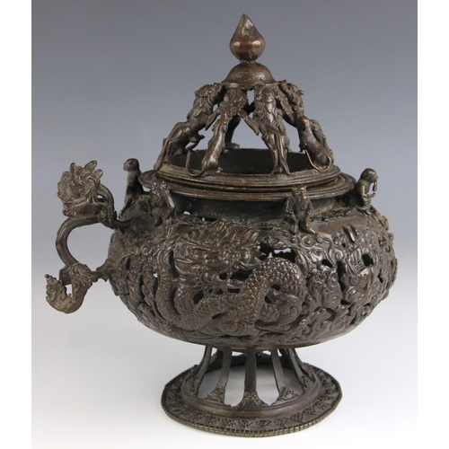 580 - A Sino-Tibetan bronze censer / incense burner, 19th century, the globular shaped reservoir with reti... 