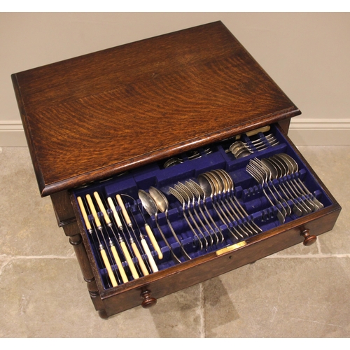 98 - A 20th century silver plated canteen of cutlery, within an oak case, the Old English pattern flatwar... 