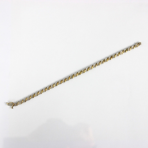 168 - A 9ct yellow and white gold bracelet, the shaped white gold panels with yellow gold spacers, with bo... 