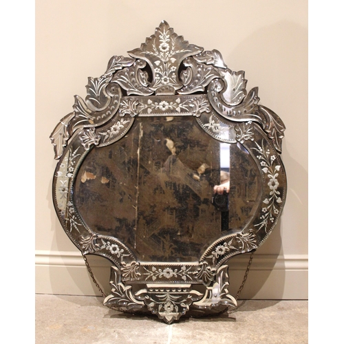 661 - An Italian Venetian style glass wall mirror, late 20th century, of sectional form, the leaf shaped p... 