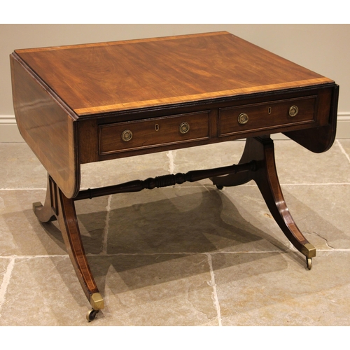 764 - A George IV mahogany and tulip wood crossbanded sofa table, the drop leaf top over a pair of cock be... 