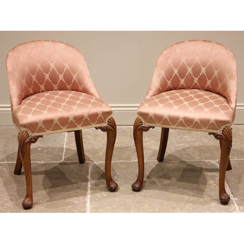 834 - A pair of Queen Anne revival walnut bedroom chairs, early to mid 20th century, each with a curved lo... 