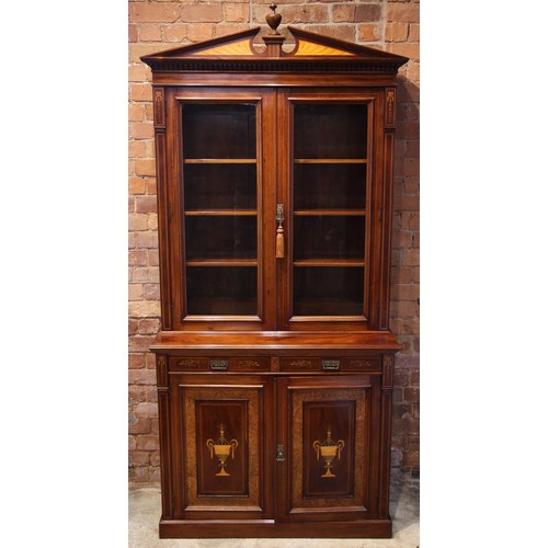 762 - An Edwardian Sheraton revival mahogany library bookcase, the architectural pediment inlaid with sati... 