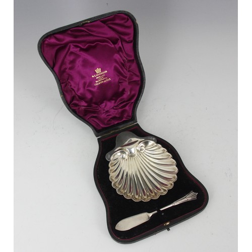 6 - A cased Victorian silver butter dish and knife, Josiah Williams & Co, London 1894, the shell shaped ... 