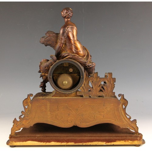 712 - A gilt spelter Louis XVI style mantel clock, late 19th century,  the 10cm enamelled drum dial surmou... 