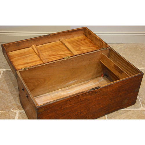 765 - A teak campaign chest, 19th century, applied with brass corner brackets, opening to a fitted candle ... 