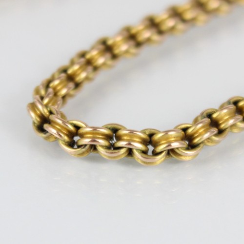 272 - A yellow metal choker style chain, of double trace link design, with applied ‘9c’ pad, bolt ring fas... 