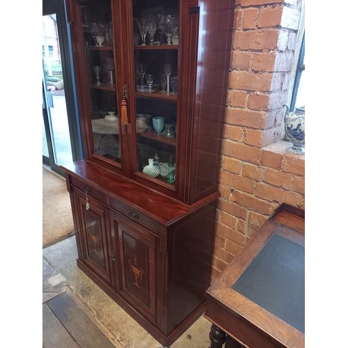 762 - An Edwardian Sheraton revival mahogany library bookcase, the architectural pediment inlaid with sati... 