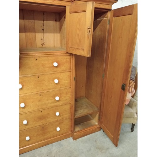 807 - A Victorian pine inverted breakfront compactum wardrobe, the moulded cornice over a pair of recessed... 