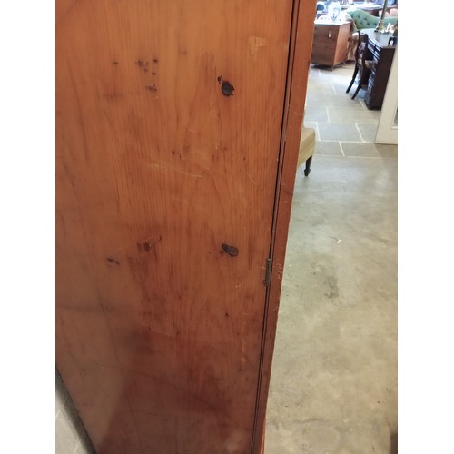 807 - A Victorian pine inverted breakfront compactum wardrobe, the moulded cornice over a pair of recessed... 