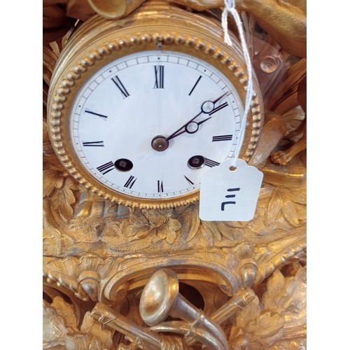 711 - A late 19th/early 20th century French gilt metal mantel clock, the 10cm white enamelled drum dial su... 