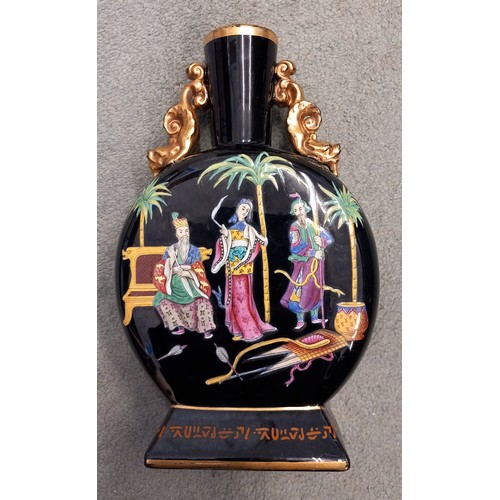 554 - A pair of Victorian Jetware moon flasks, each of typical form and decorated in polychrome enamel wit... 