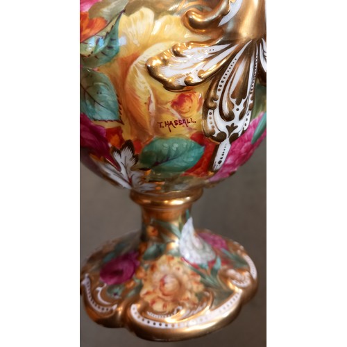 557 - A pair of late 19th century Copelands China 'Rococo' vases, each extensively painted in polychrome e... 