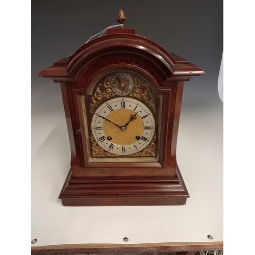 710 - A German walnut cased bracket clock, by Mathias Bauerle, late 19th/early 20th century, the arched ca... 