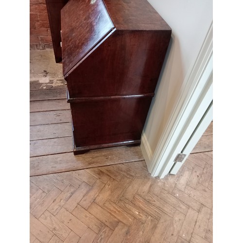 717 - A George II burr walnut and feather banded bureau, the fall front opening to a compartmented interio... 