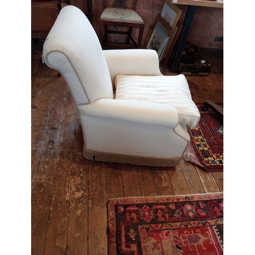 826 - An early 20th century club armchair, late re-covered in ivory coloured fabric and applied with cord ... 