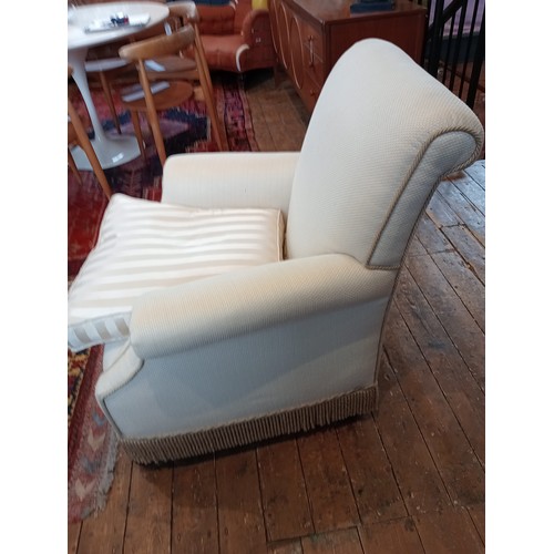 826 - An early 20th century club armchair, late re-covered in ivory coloured fabric and applied with cord ... 