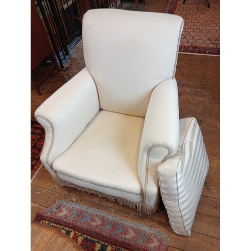 826 - An early 20th century club armchair, late re-covered in ivory coloured fabric and applied with cord ... 