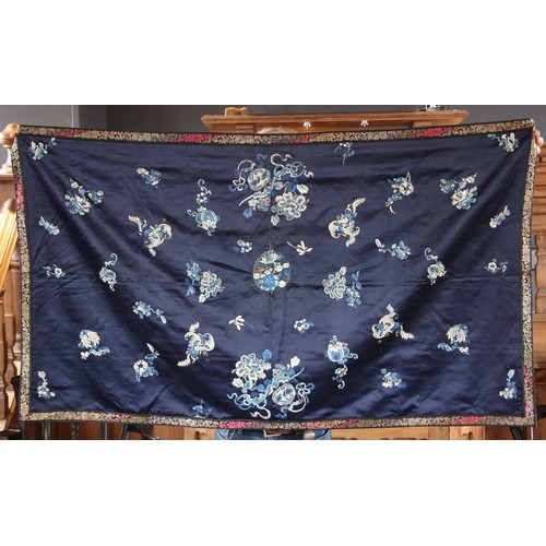 608 - A Chinese silk embroidered panel, 19th century, the rectangular panel with a deep blue ground both l... 