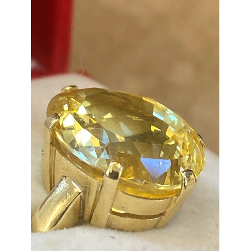 257 - A bespoke untested yellow sapphire cocktail ring, possibly Sri Lankan, the fancy oval cut stone with... 