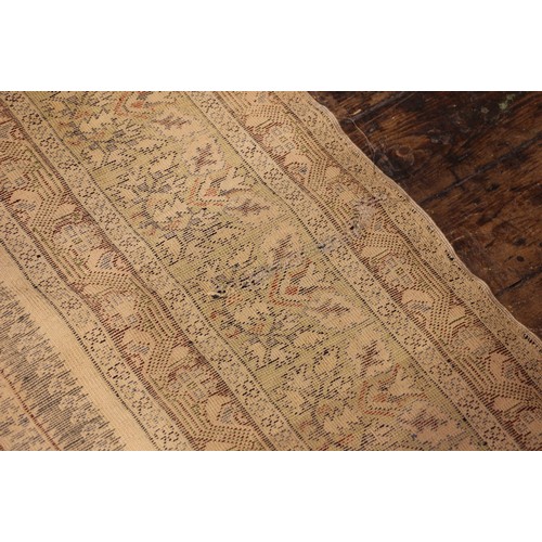 611 - A silkwork rug, late 19th/early 20th century, in ivory, green and brown colorways, the central field... 