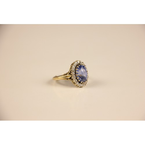 348 - An Edwardian certified sapphire and diamond cluster ring, the oval cut sapphire within a surround of... 