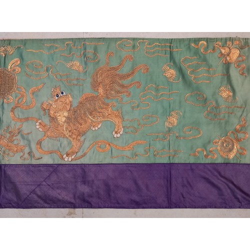 609 - A Chinese silk embroidered panel, early 20th century, the rectangular panel stitched with golden thr... 