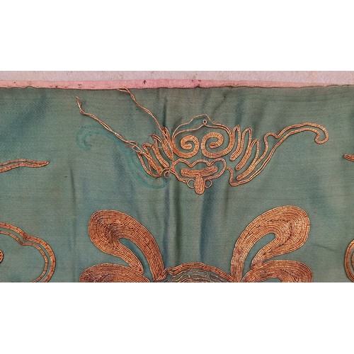 609 - A Chinese silk embroidered panel, early 20th century, the rectangular panel stitched with golden thr... 