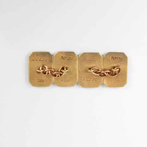 194 - A pair of 9ct yellow gold cufflinks, the rectangular cufflinks with canted corners and engraved deta... 