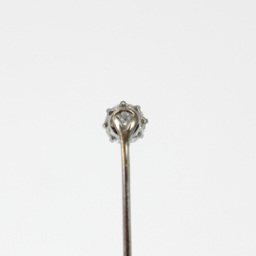 197 - An early 20th century diamond stick pin, the central old cut diamond in white metal claw setting edg... 